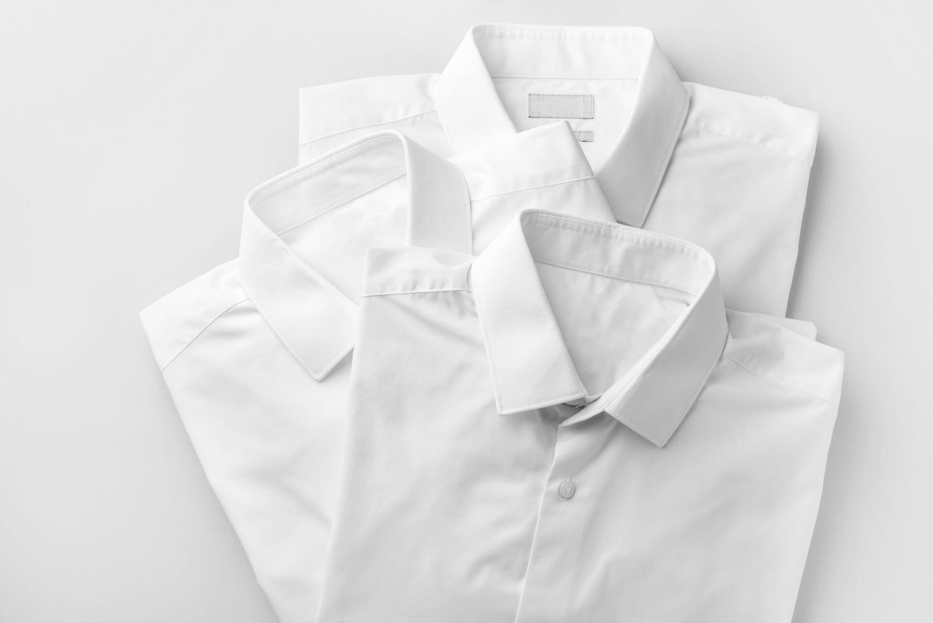 Three white shirts on a white background.